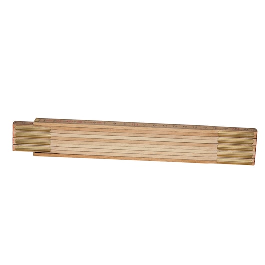 Wooden folding ruler with brass joints, closed and laid flat on a white background.