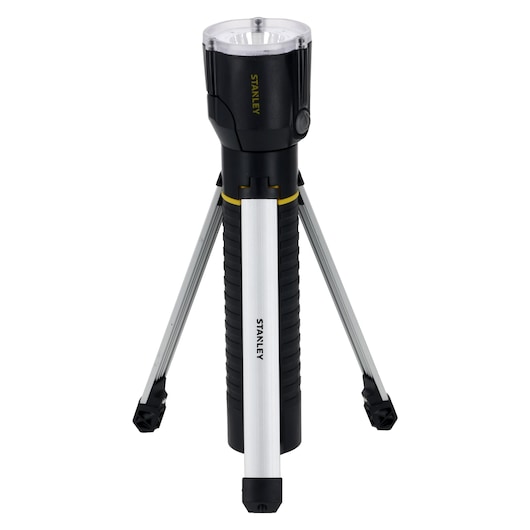 A STANLEY multifunctional flashlight with an extendable tripod base, shown in an upright position. The product features a black and silver design with visible brand marking on its body.