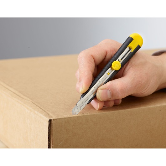 Photo of STANLEY 1-10-409 utility knife with yellow and black handle cutting a cardboard box.