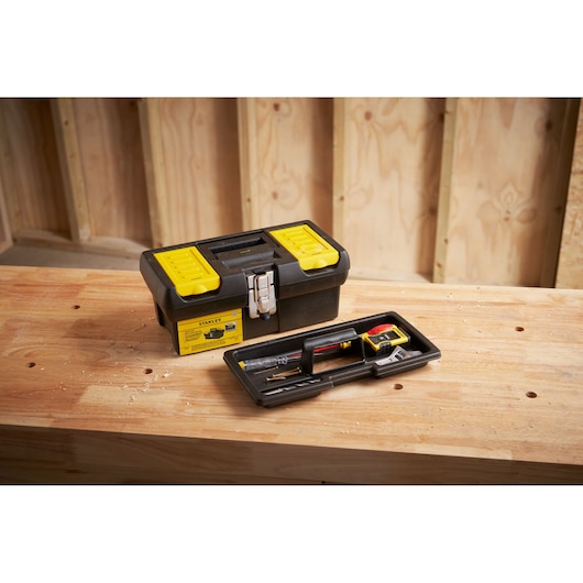 STANLEY 1-92-064 black and yellow toolbox with removable tray shown on workbench.