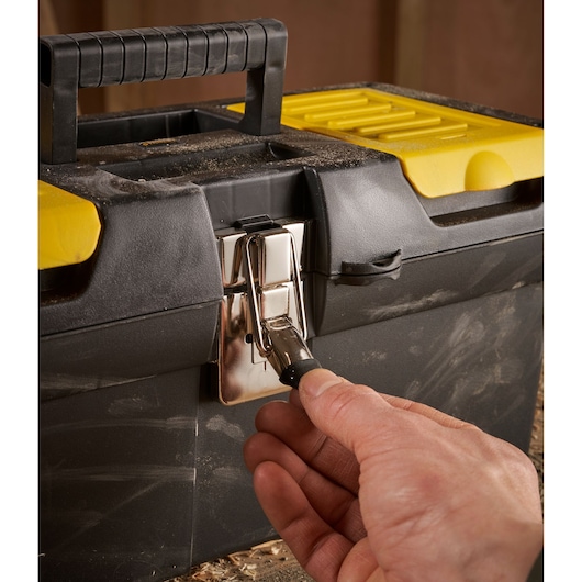 STANLEY 1-92-065 toolbox with black handle and yellow lid, hand opening metal latch, front angle photo.