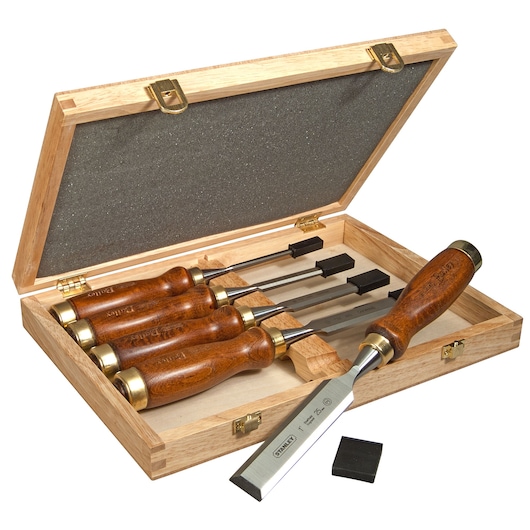STANLEY 2-16-217 wood chisel set with four chisels, wooden handles, in an open wooden storage case, front angle.