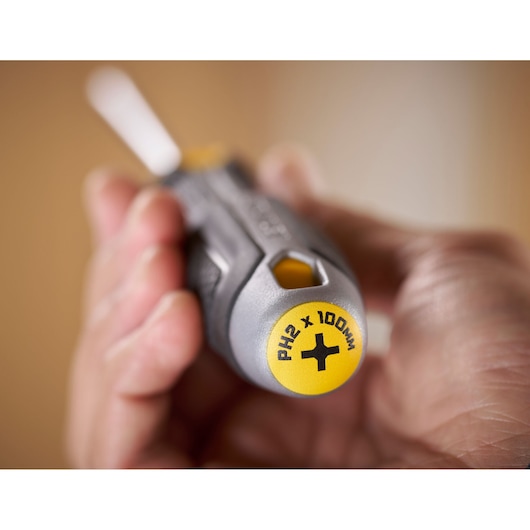 Close-up of a hand holding a Stanley PH2 x 100mm Phillips screwdriver.