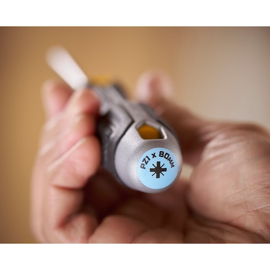 Close-up of a hand holding a STANLEY screwdriver, tip marked PZ1 x 80mm.