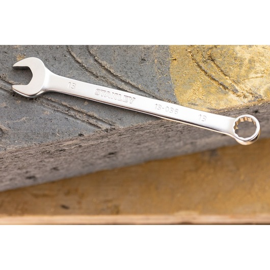 STANLEY FMMT13039-0 combination wrench, silver metal, 13mm, product photography on stone surface