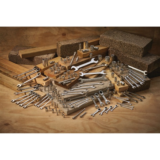 STANLEY FMMT13089-0 assorted metal wrenches and sockets photography, tools arranged on wooden blocks.