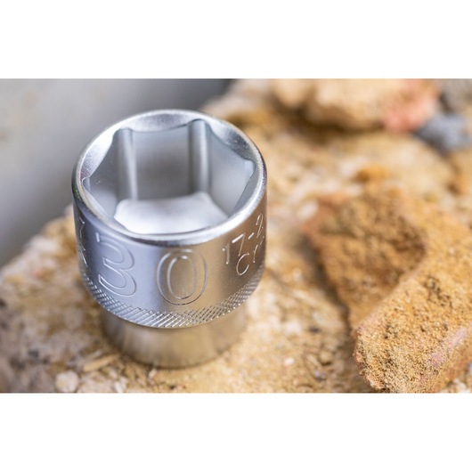 STANLEY FMMT17245-0 socket, polished silver finish, close-up photography on rough stone surface.