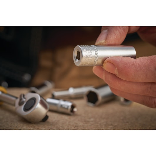 Photo of STANLEY FMMT17523-0 socket tool held in hand, with other socket tools blurred in background.