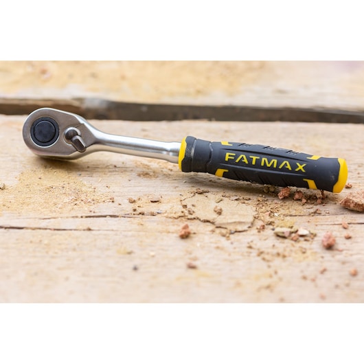 STANLEY FMMT82683-0 ratchet wrench with black and yellow FATMAX handle on wooden surface.