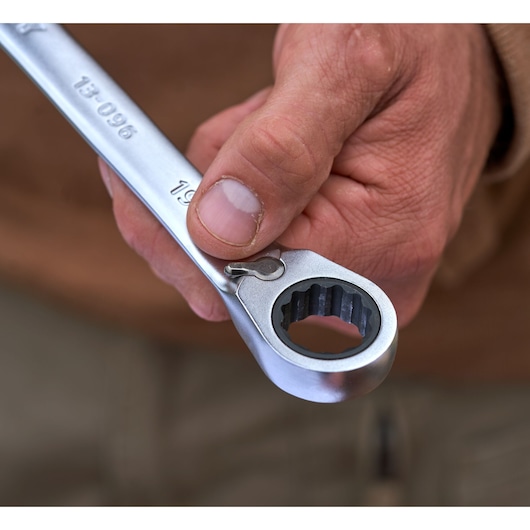 Close-up photo of STANLEY FMMT82848-0 reversible ratcheting wrench from STANLEY FATMAX 7-piece set held in hand.