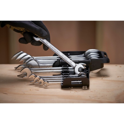 STANLEY FMMT82902-0 wrench set in holder, side angle, gloved hand selecting wrench.