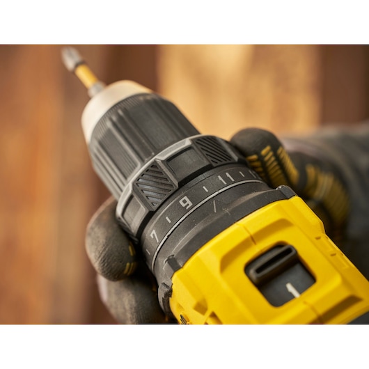 Photo of STANLEY SFMCD714D2T cordless drill showing close-up of torque adjustment and yellow body.