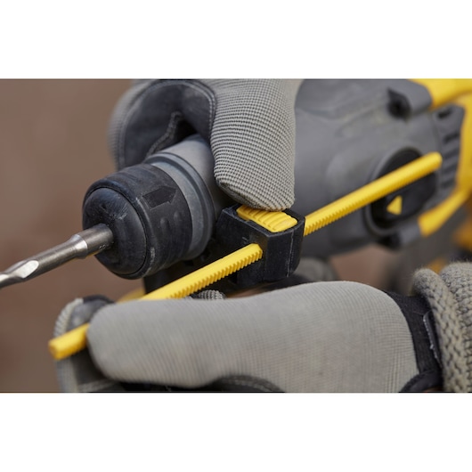 STANLEY SFMCH900M22 photography of depth stop adjustment on cordless drill, close-up view, gray and yellow details.