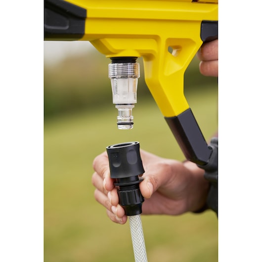STANLEY SFMCPC93B photography of yellow pressure washer hose connector close up outdoors.