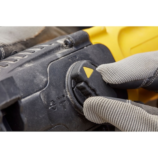 STANLEY SFMEH200K photography close-up of mode selector switch on power tool with gloved hand.