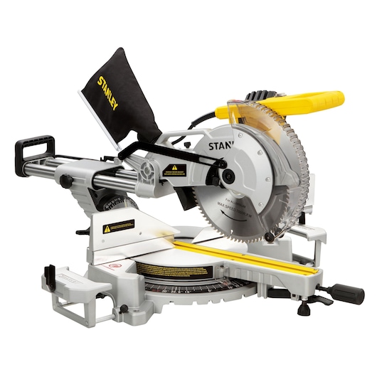 STANLEY SM1800 sliding compound miter saw side angle, featuring silver body, black dust bag, and yellow handle.