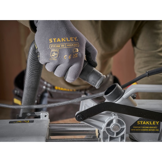 STANLEY SM1800 photography of gloved hand connecting hose to machine, close-up angle.