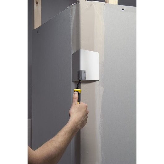 STANLEY STHT0-05622 corner trowel in use smoothing wall joint compound.
