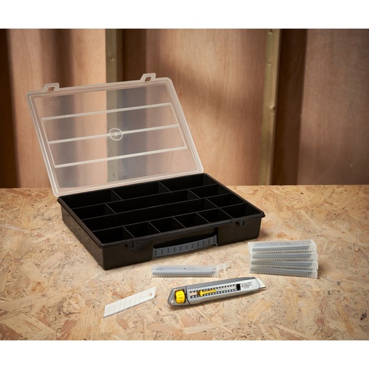 STANLEY STHT10018-9 utility knife, blade packs, and black compartment organizer, front angle.