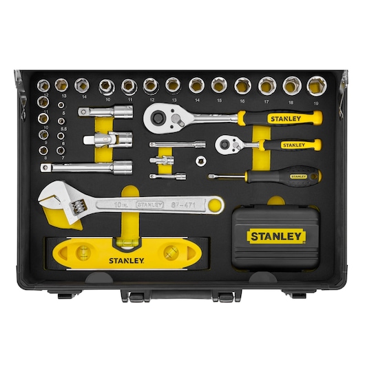 STANLEY STMT72986-1 tool set with sockets, ratchets, screwdrivers, adjustable wrench, and level in black case, top view.