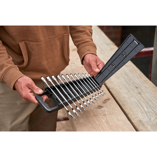STANLEY STMT82843-0 combination wrench set, 12 pieces, in black plastic holder, shown held by person.