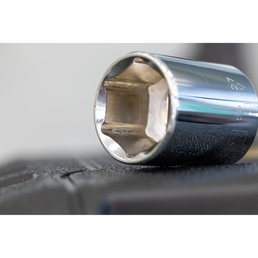 STANLEY STMT86532-0 chrome socket, photography close-up of tool on black surface.