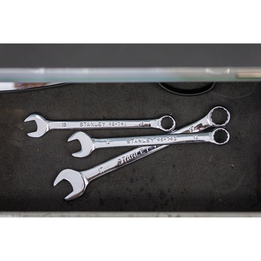 Stanley STMT95791-0 photography of chrome combination wrenches in a toolbox drawer, top view.