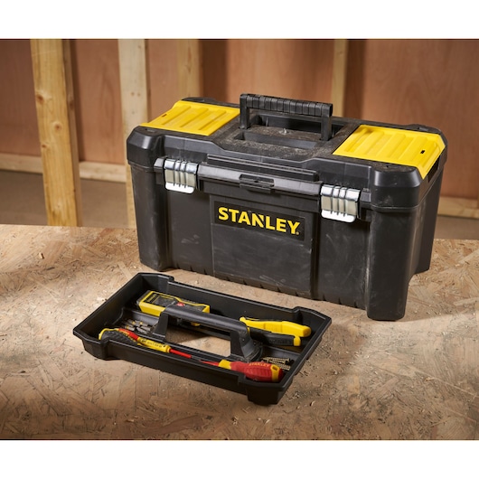 STANLEY STST1-75521 black and yellow toolbox with tray and tools, shown on a workshop table.
