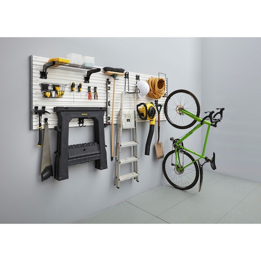 STANLEY STST82602-1 garage wall organizer with tools, ladder, bike, and accessories, front angle photography.